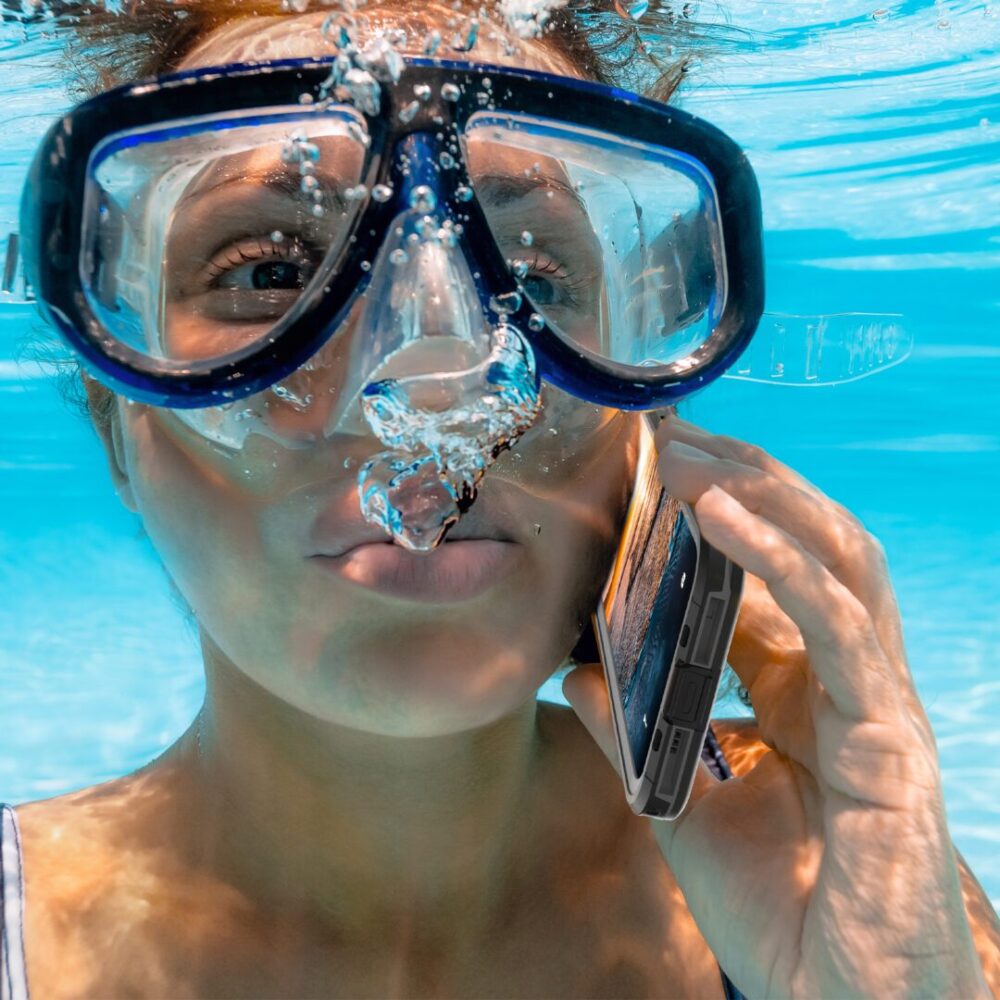 A Girl Into Water With iPhone 15 Plus IP68 Waterproof Phone Case On Her Hand